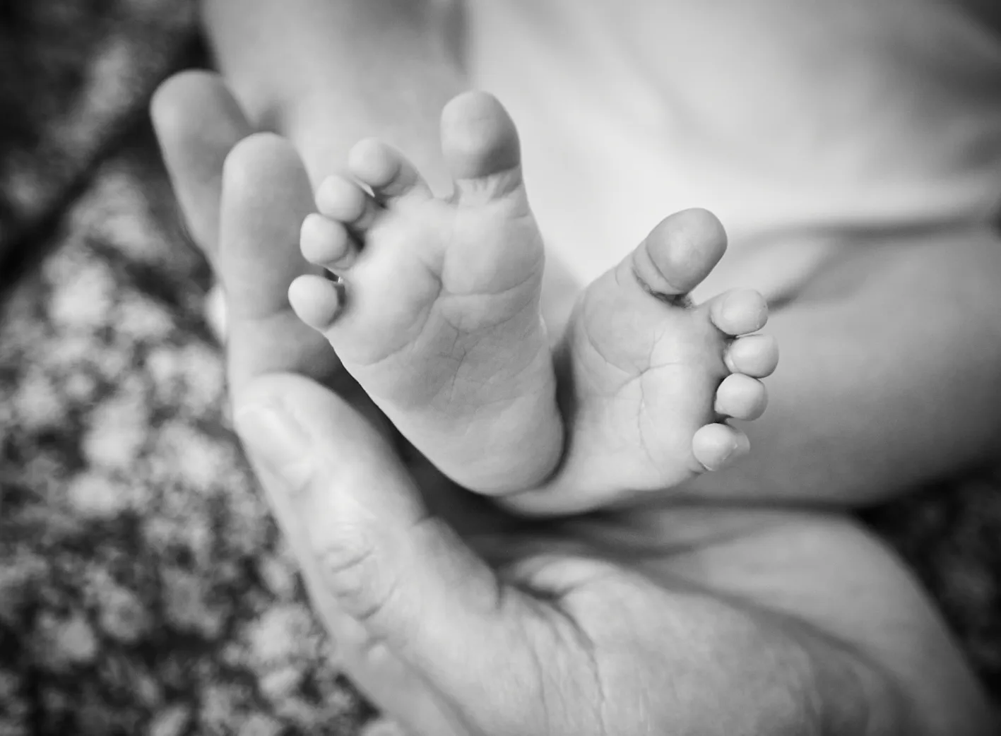 Newborn baby swaddled shortly after delivery