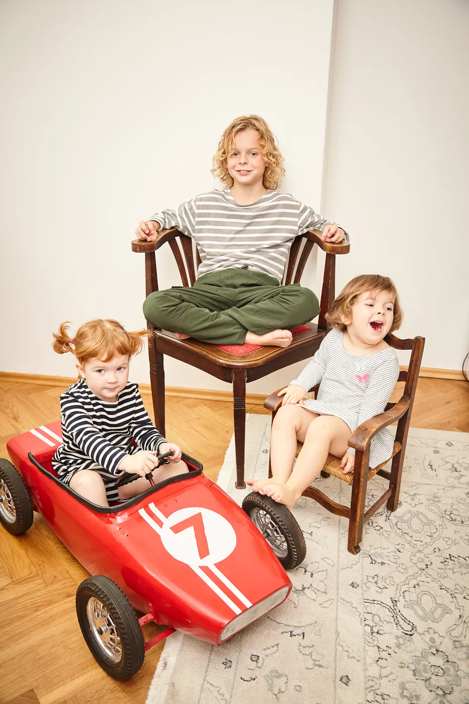 Child smiling during a playful family portrait session