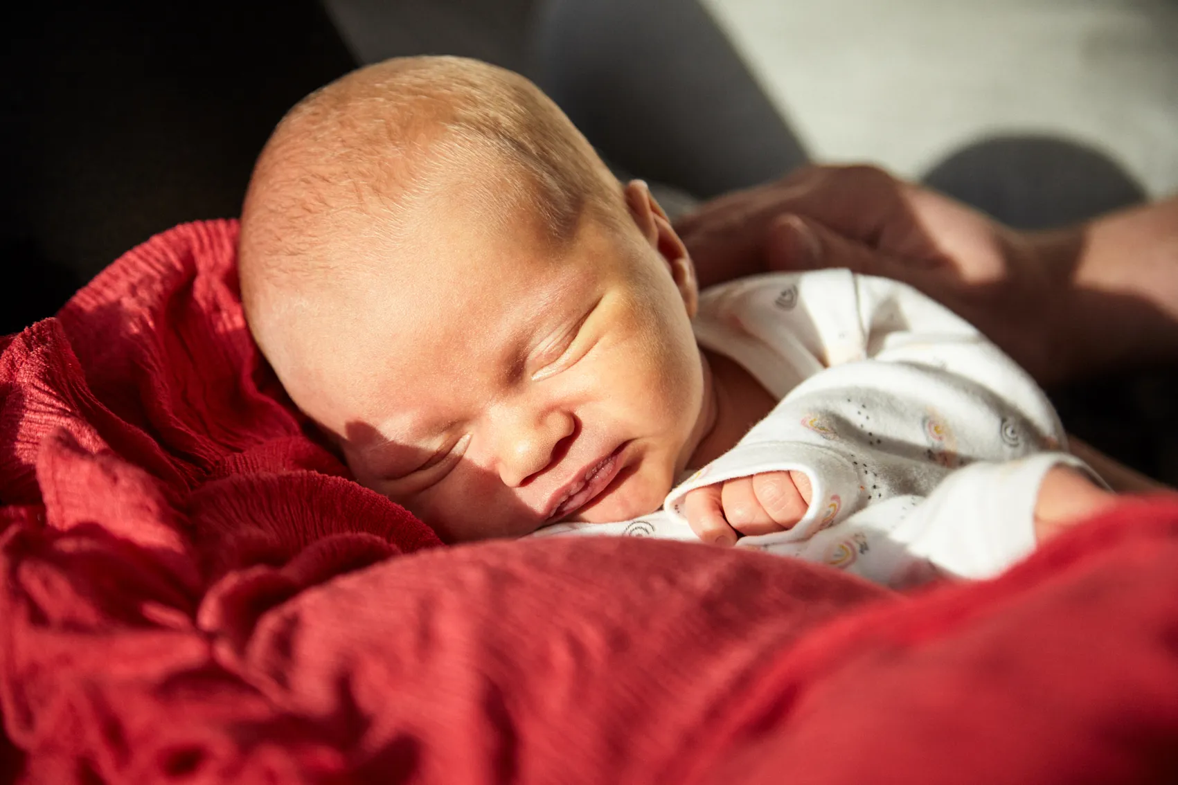 Newborn sleeping soundly in the first days of life