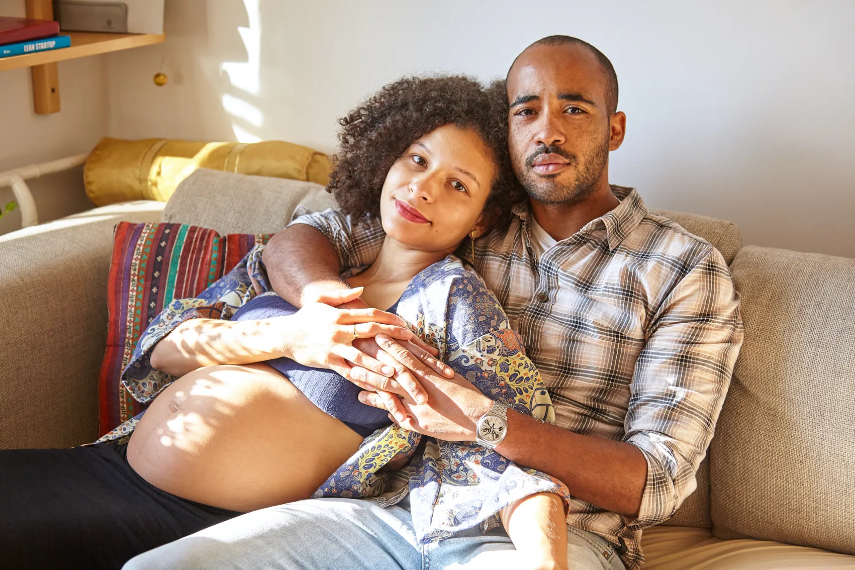 Parents-to-be sharing an intimate moment during pregnancy